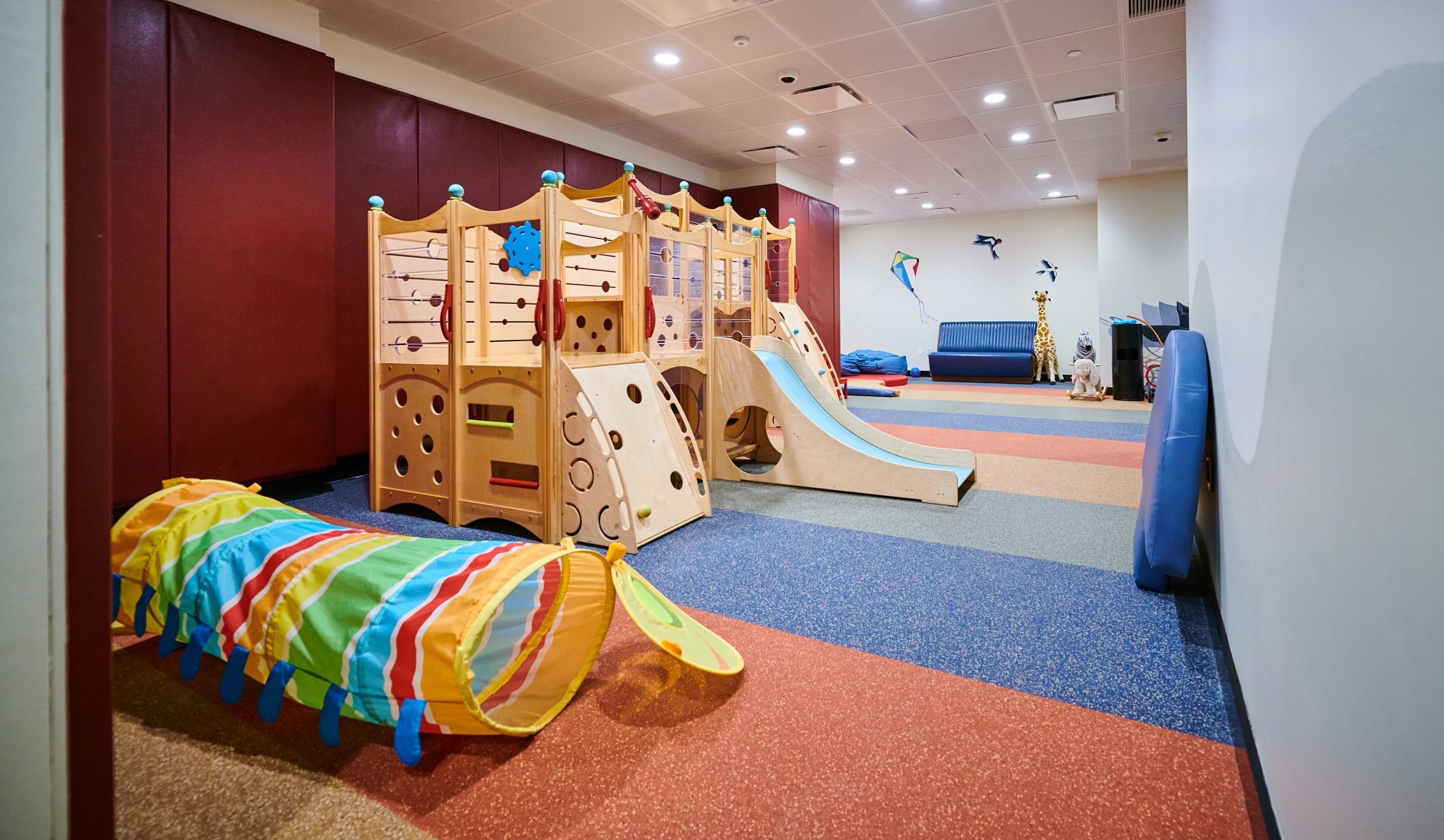 A room with a slide and some toys